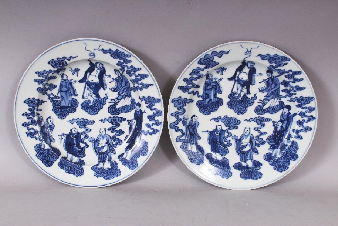 A PAIR OF GOOD QUALITY CHINESE BLUE & WHITE PORCELAIN: A PAIR OF GOOD QUALITY CHINESE BLUE & WHITE PORCELAIN PLATES, each decorated with the Eight Immortals supported on clouds, each base with a six-character Xuande mark, 8in diameter.