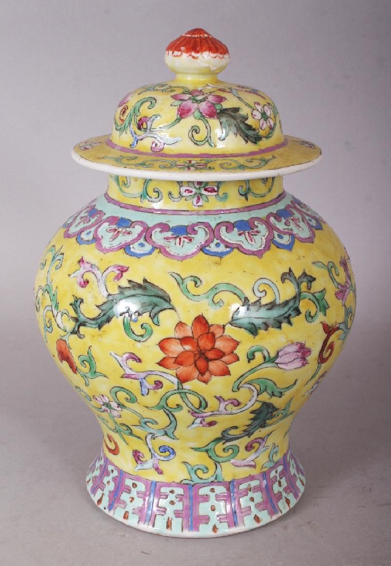 A 19TH CENTURY CHINESE FAMILLE ROSE YELLOW GROUND: A 19TH CENTURY CHINESE FAMILLE ROSE YELLOW GROUND PORCELAIN VASE & COVER, the sides painted with scrolling foliage, 8.7in high overall.