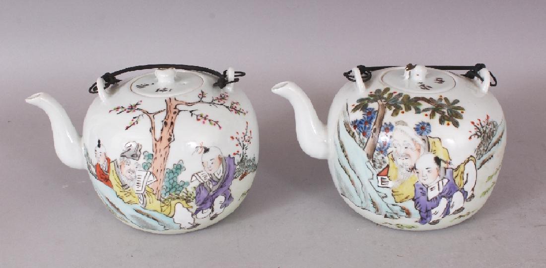 A PAIR OF 19TH/20TH CENTURY CHINESE FAMILLE ROSE: A PAIR OF 19TH/20TH CENTURY CHINESE FAMILLE ROSE PORCELAIN TEAPOTS & COVERS, with metal swing handles, each globular body decorated with a sage and boy scene, each base with a Tongzhi seal mark, 6.75i