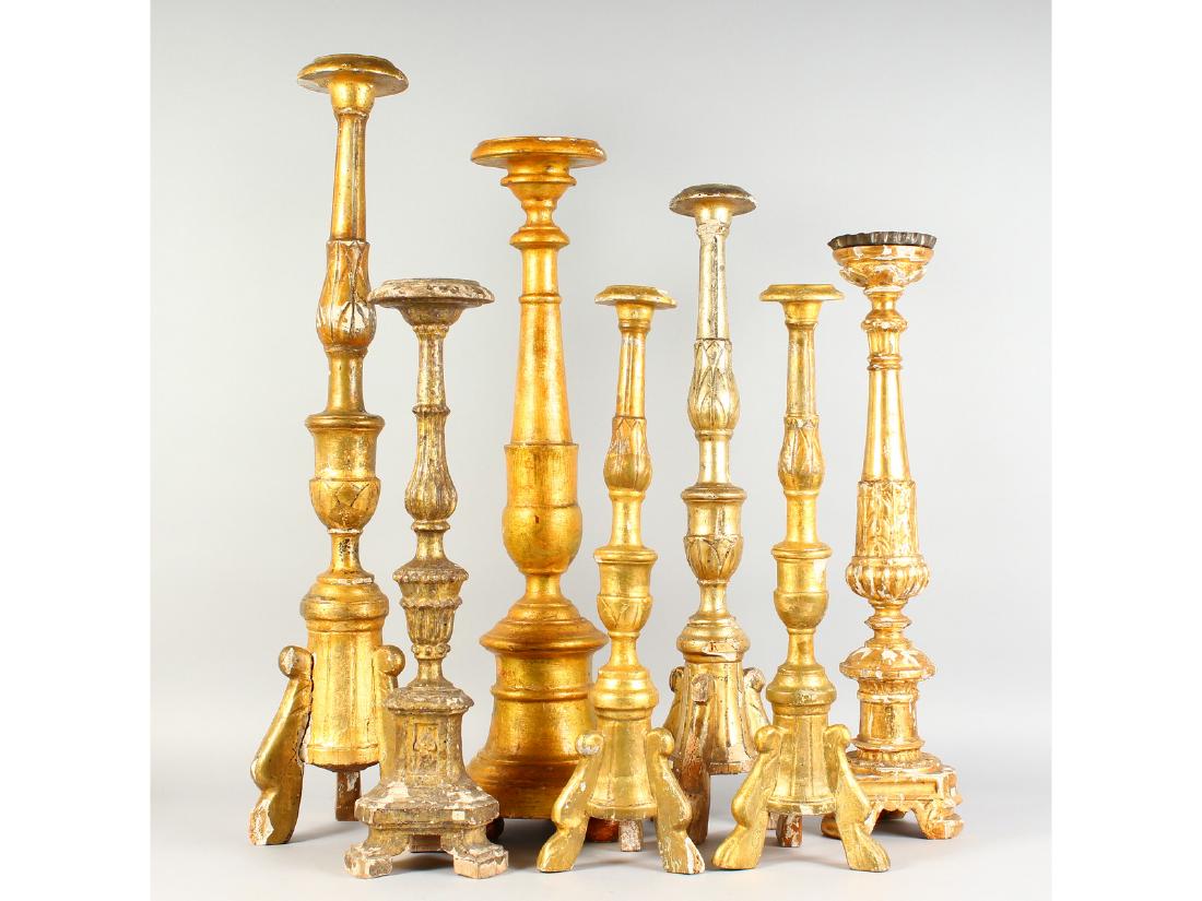 SEVEN VARIOUS ITALIAN CARVED AND GILDED PRICKET (1 of 1)