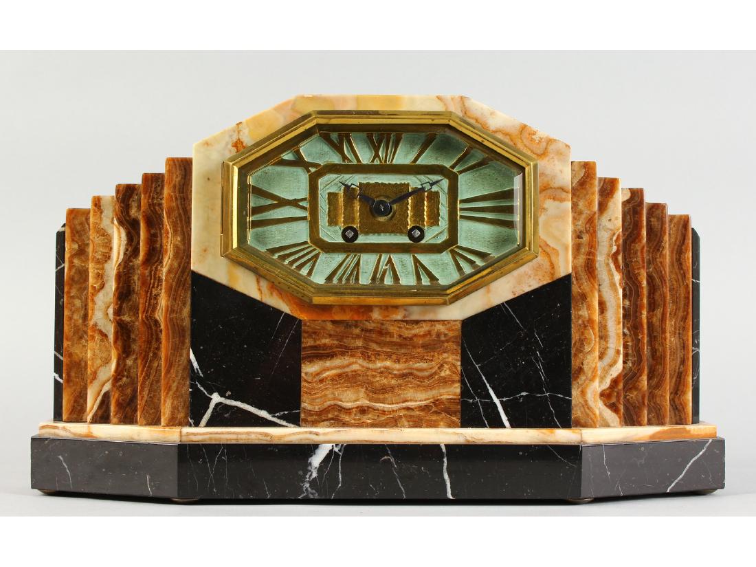 A 1920'S ART DECO MANTLE CLOCK with various coloured (1 of 5)