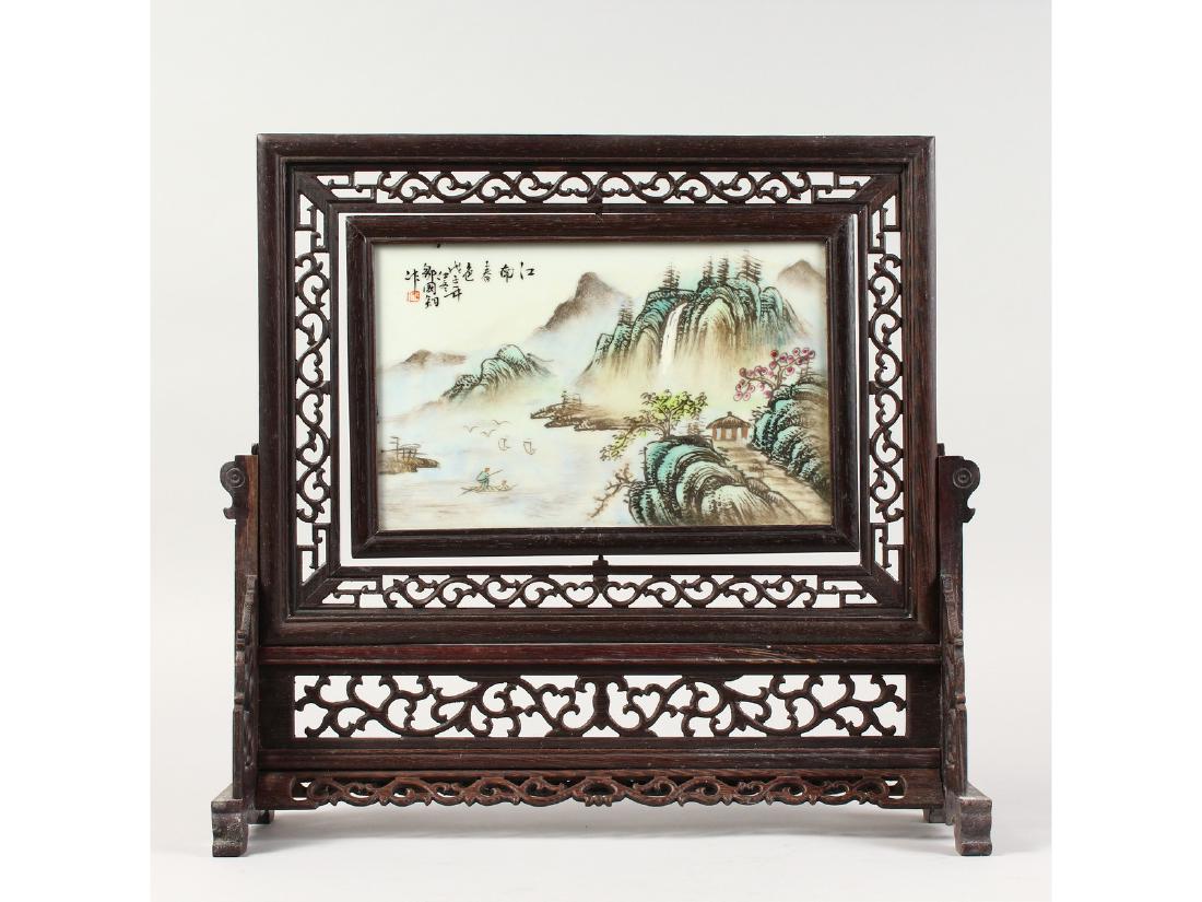 A CHINESE PORCELAIN SCREEN ON A STAND. (1 of 4)