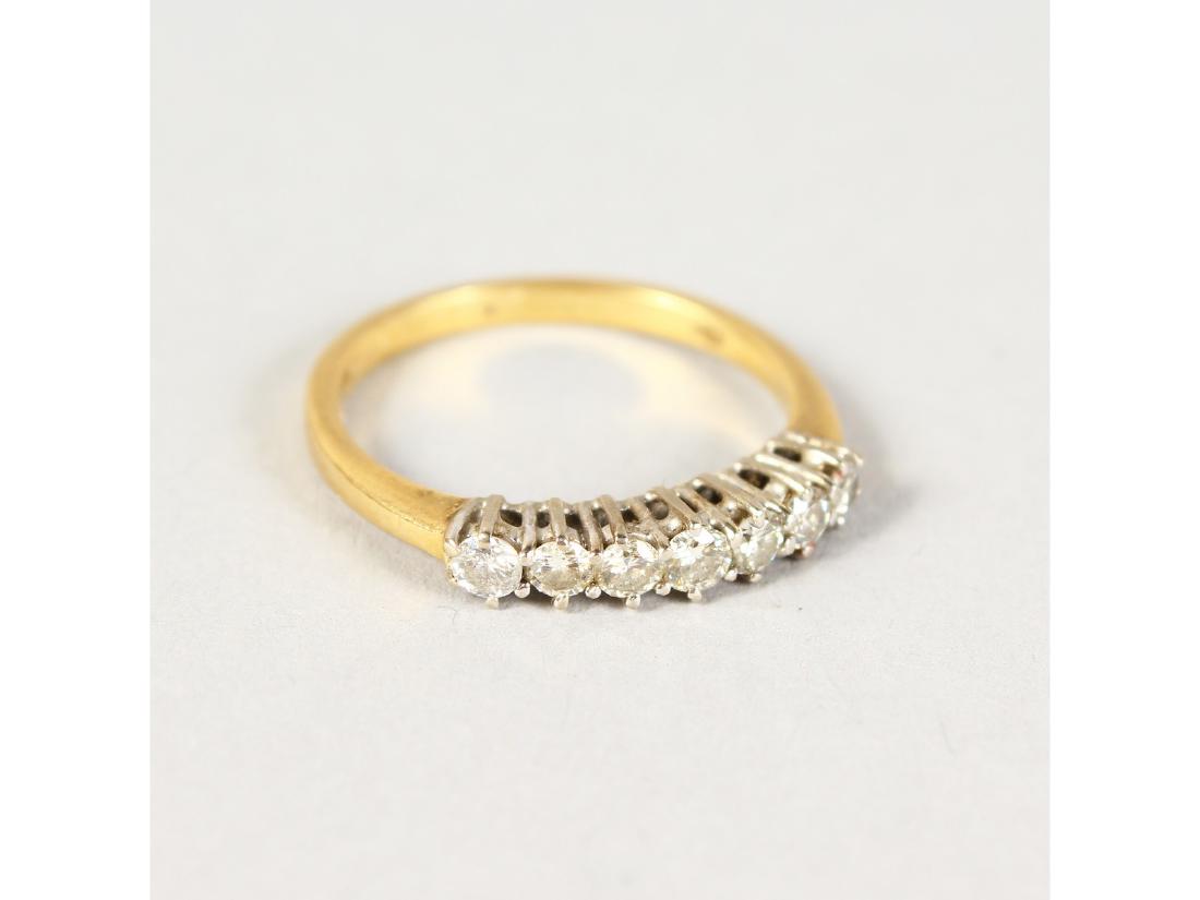 AN 18CT GOLD SEVEN-STONE DIAMOND RING. (1 of 2)