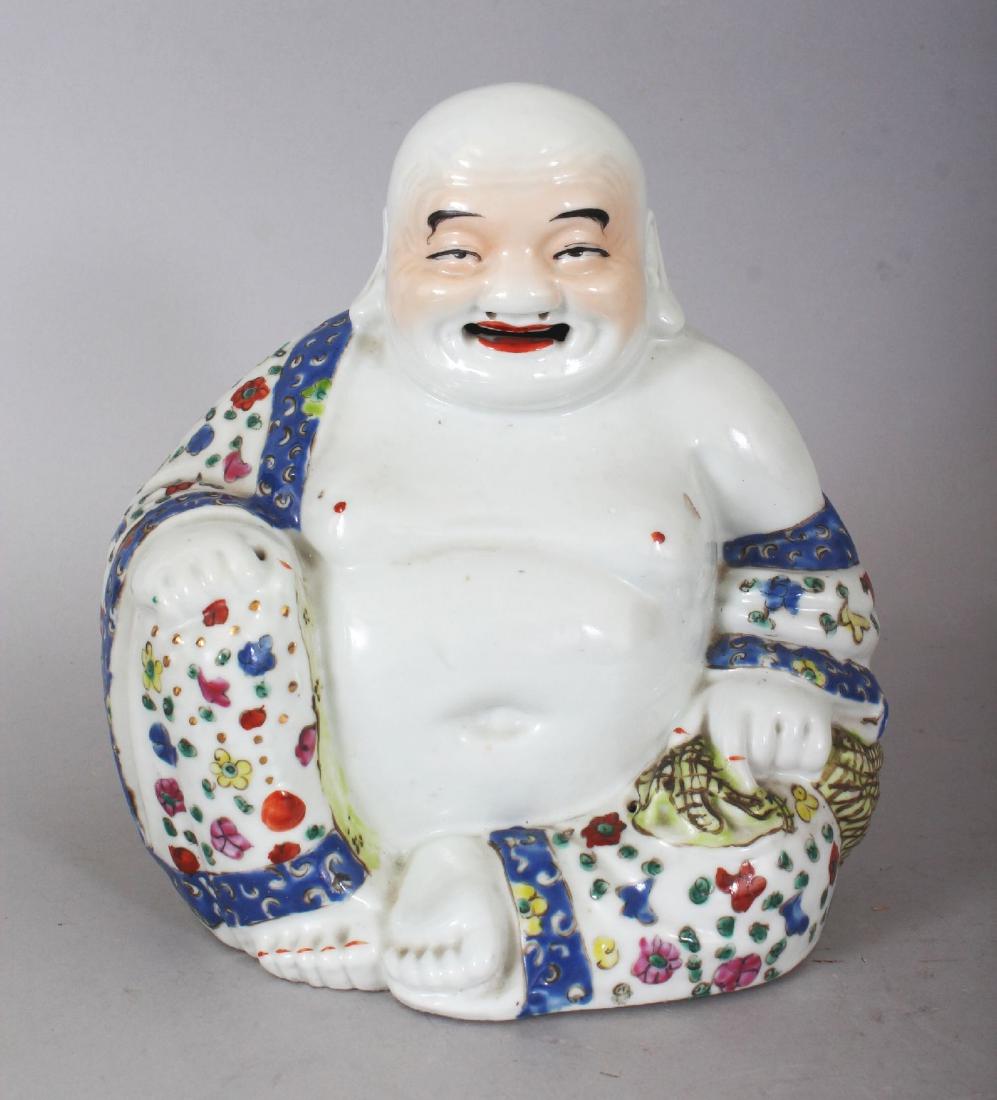 AN EARLY 20TH CENTURY CHINESE REPUBLIC PERIOD FAMILLE: AN EARLY 20TH CENTURY CHINESE REPUBLIC PERIOD FAMILLE ROSE PORCELAIN MODEL OF BUDAI, seated with exposed belly and cheerful expression, the unglazed base with an impressed mark, 7.25in wide at widest 