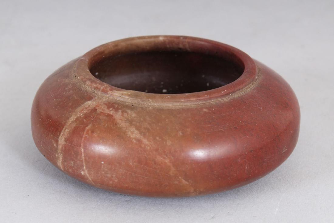 A SMALL CHINESE CIRCULAR STONE BRUSH WASHER.  3.25ins (1 of 1)