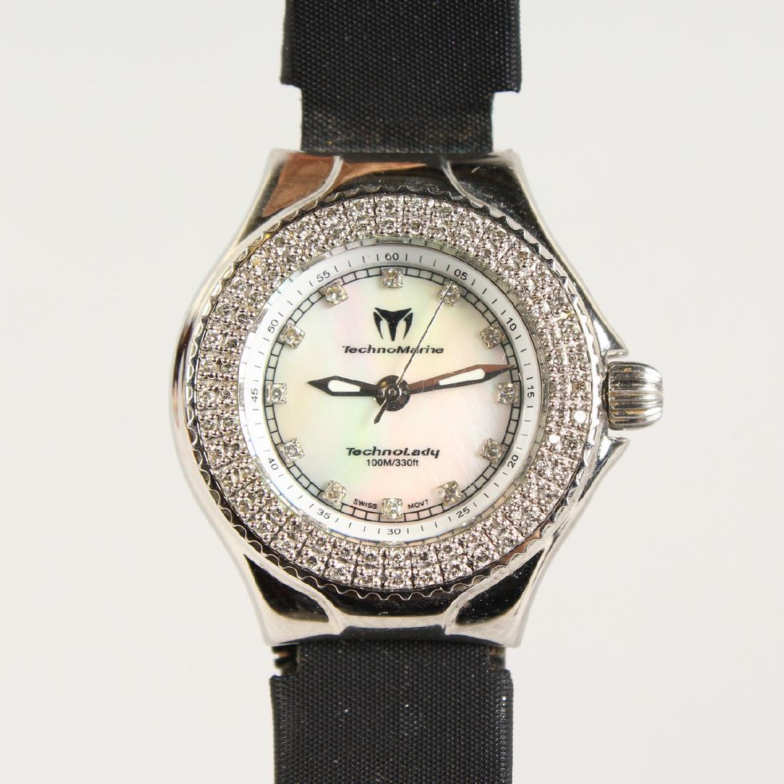 A LADIES TECHNOMARINE WRISTWATCH, with diamond surround: A LADIES TECHNOMARINE WRISTWATCH, with diamond surround and leather strap.