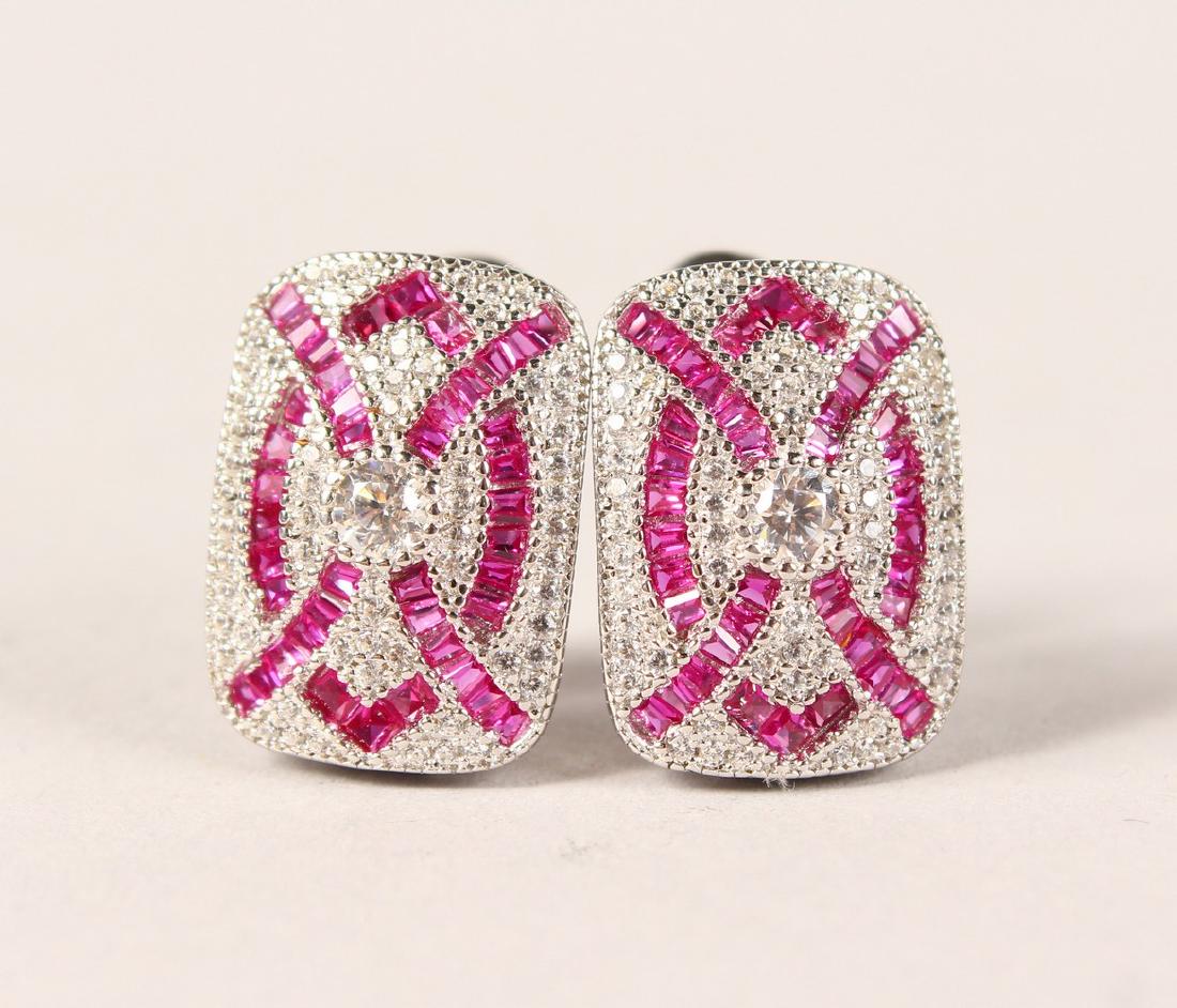 A PAIR OF SILVER, WHITE AND RED ZIRCON DECO STYLE: A PAIR OF SILVER, WHITE AND RED ZIRCON DECO STYLE EARRINGS.