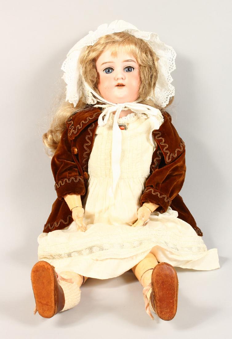 AN ARMAND MARSEILLE BISQUE HEADED DOLL, Mark A9M, long: AN ARMAND MARSEILLE BISQUE HEADED DOLL, Mark A9M, long flowing hair, white bonnet and articulated body. 25ins long.