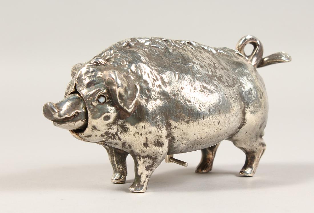 A CAST BOAR TABLE BELL. 6.5ins long.: A CAST BOAR TABLE BELL. 6.5ins long.