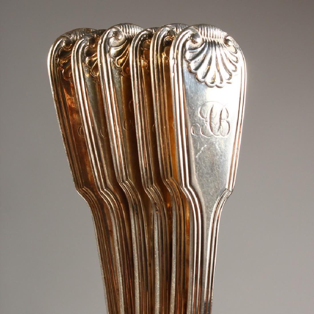 A SET OF SIX GEORGE IV FIDDLE, THREAD AND SHELL DESSERT: A SET OF SIX GEORGE IV FIDDLE, THREAD AND SHELL DESSERT SPOONS. London 1825. Maker: H. I. Weight 9ozs.