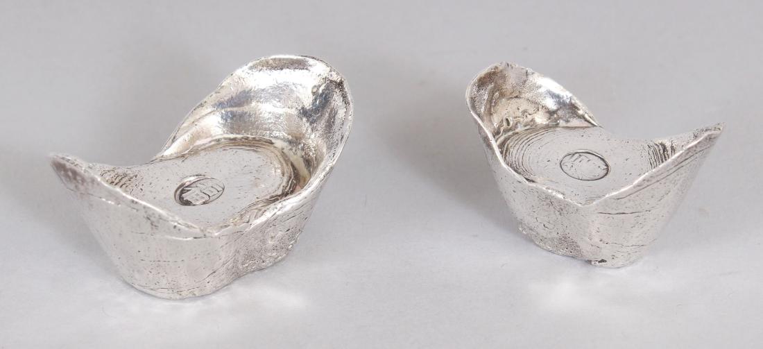 TWO 20TH CENTURY CHINESE SILVER METAL INGOTS, weighing (1 of 7)