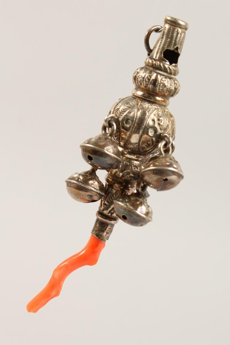 A CHILD'S VICTORIAN SILVER AND CORAL RATTLE.  8.5cms (1 of 3)