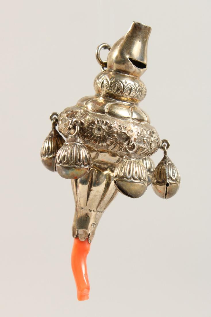 A CHILD'S VICTORIAN SILVER AND CORAL RATTLE.  11cms (1 of 4)