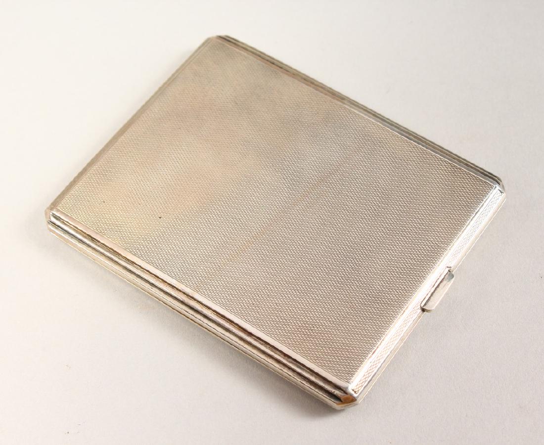 AN ENGINE TURNED SILVER CIGARETTE CASE.  10cms x 8cms. (1 of 7)