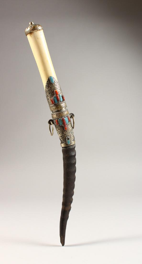 A GOOD ISLAMIC BONE HANDLED HORN KNIFE, with silver and: A GOOD ISLAMIC BONE HANDLED HORN KNIFE, with silver and stone mounts. 16ins long.