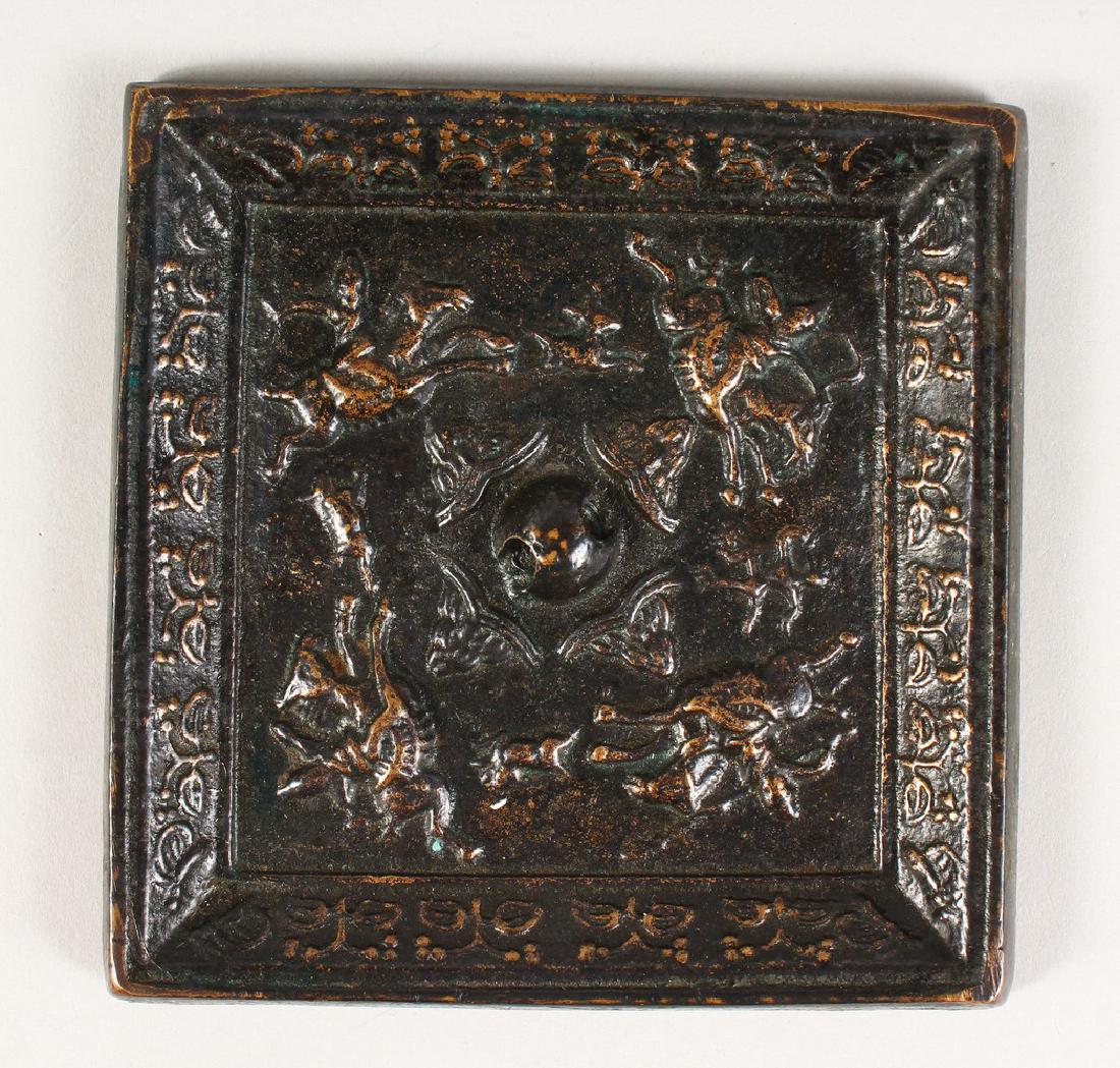 A CHINESE BRONZE SQUARE MIRROR.  11cms. (1 of 3)