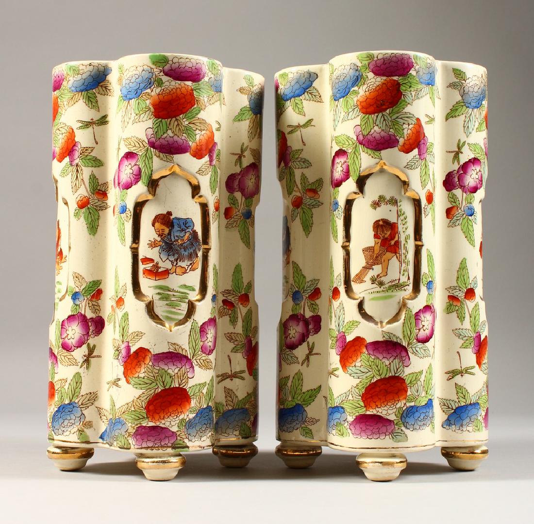 A PAIR OF LATE 19TH CENTURY EARTHENWARE VASES, in the: A PAIR OF LATE 19TH CENTURY EARTHENWARE VASES, in the Japanese taster, signed Japan BFK. 10INS HIGH.