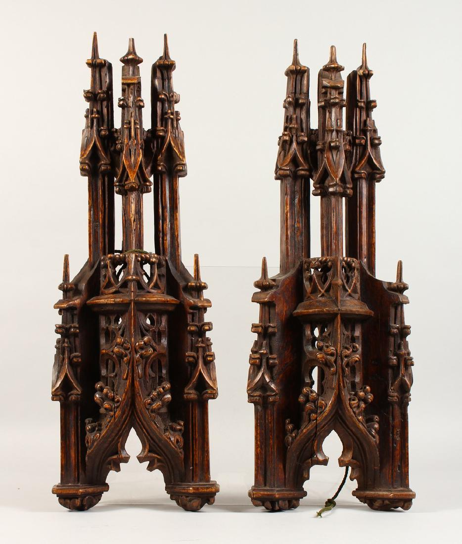 A PAIR OF 19TH CENTURY CARVED WOOD GOTHIC FINIALS.: A PAIR OF 19TH CENTURY CARVED WOOD GOTHIC FINIALS. 22ins high.