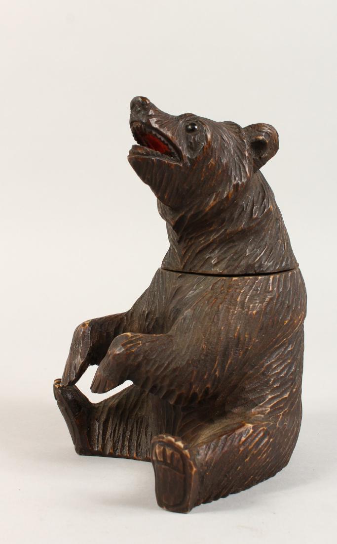 A BLACK FOREST STYLE CARVED BEAR TOBACCO JAR. 8ins: A BLACK FOREST STYLE CARVED BEAR TOBACCO JAR. 8ins high.