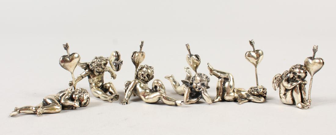 SIX SILVER CUPID MENU HOLDERS.: SIX SILVER CUPID MENU HOLDERS.