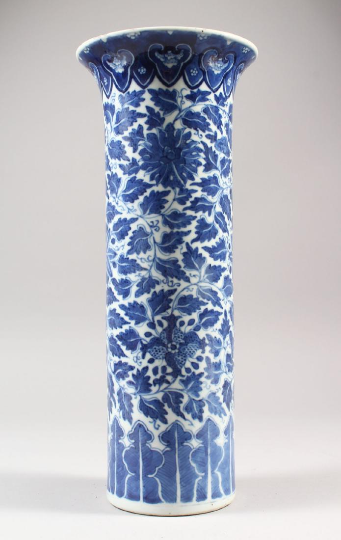 A 19TH CENTURY CHINESE BLUE & WHITE PORCELAIN VASE, the: A 19TH CENTURY CHINESE BLUE & WHITE PORCELAIN VASE, the cylindrical sides painted with formal leafage and flowerheads, the everted rim with a ruyi border, the base with a four-character Xuande mark, 3