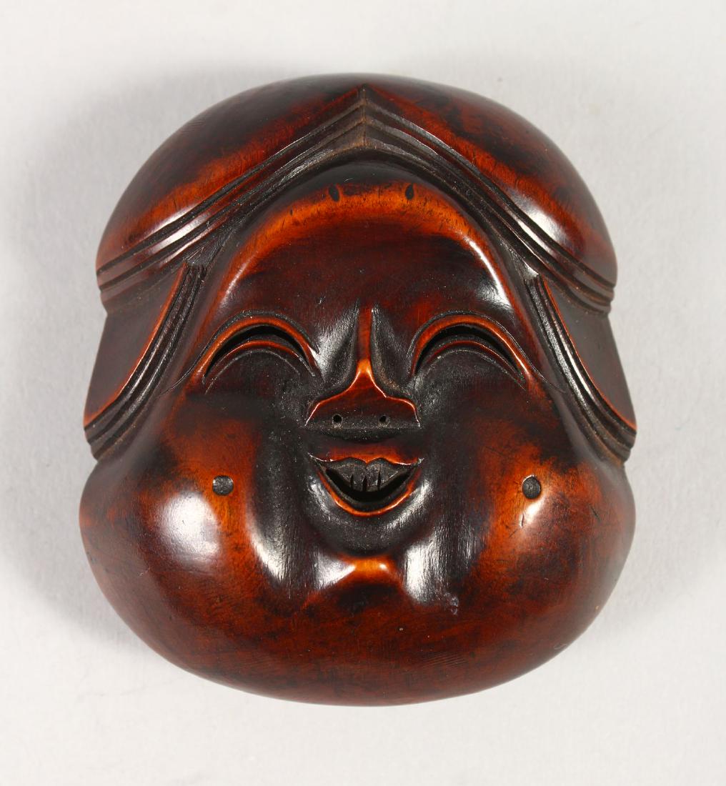 A JAPANESE LARGE CARVED BOXWOOD NETSUKE OF OKAME, Meiji (1 of 3)
