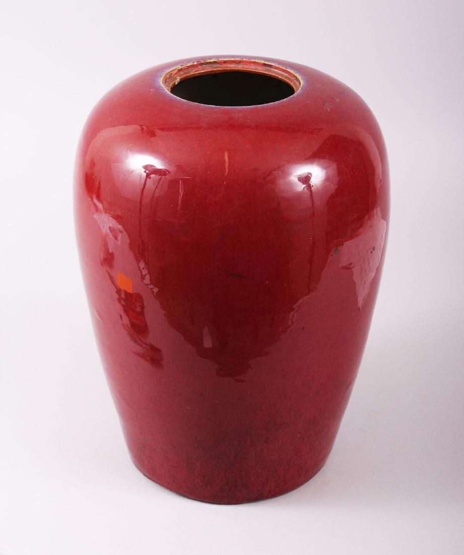 A GOOD 19TH CENTURY CHINESE SANG DE BOUEF FLAMBE JAR,: A GOOD 19TH CENTURY CHINESE SANG DE BOUEF FLAMBE JAR, 29.5cm high, 22.1cm wide.