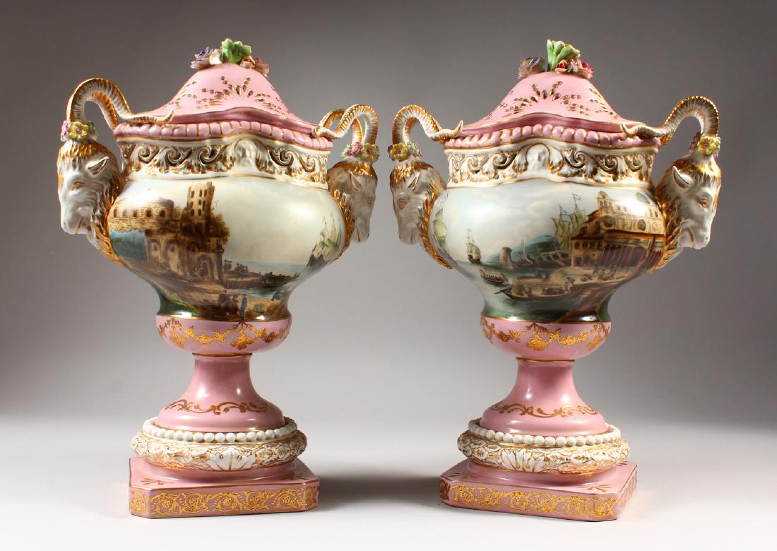 A PAIR OF CONTINENTAL STYLE POTPOURRI VASES, STANDS AND: A PAIR OF CONTINENTAL STYLE POTPOURRI VASES, STANDS AND COVERS, with goat head handles, decorated with harbour scenes. 15.5ins high.