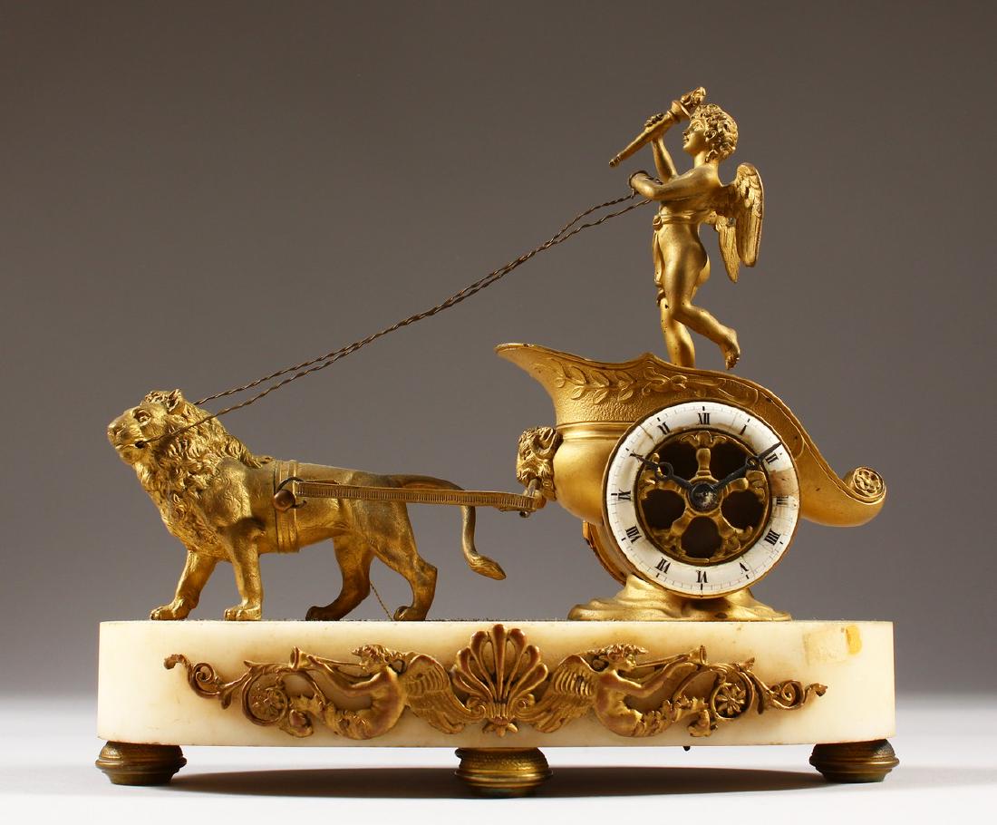 A FRENCH 19TH CENTURY GILT METAL AND MARBLE CLOCK: A FRENCH 19TH CENTURY GILT METAL AND MARBLE CLOCK formed as a chariot, the wheel with a clock movement. 22cms long.