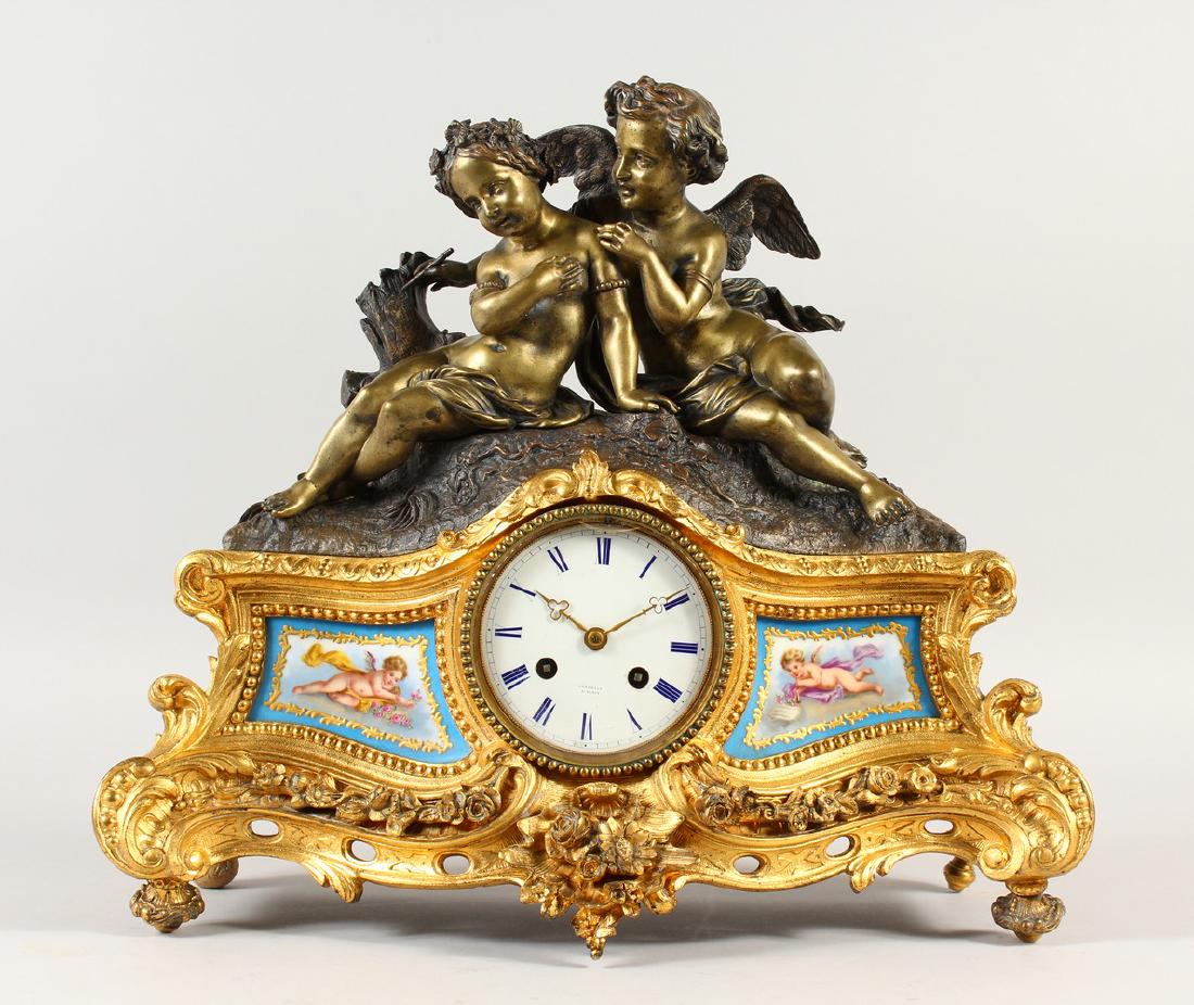 A GOOD 19TH CENTURY FRENCH ORMOLU, BRONZE AND SEVRES: A GOOD 19TH CENTURY FRENCH ORMOLU, BRONZE AND SEVRES CLOCK by LAMBELIN, PARIS, surmounted by two cupids in a case with acanthus scrolls and garlands. 37cms high.
