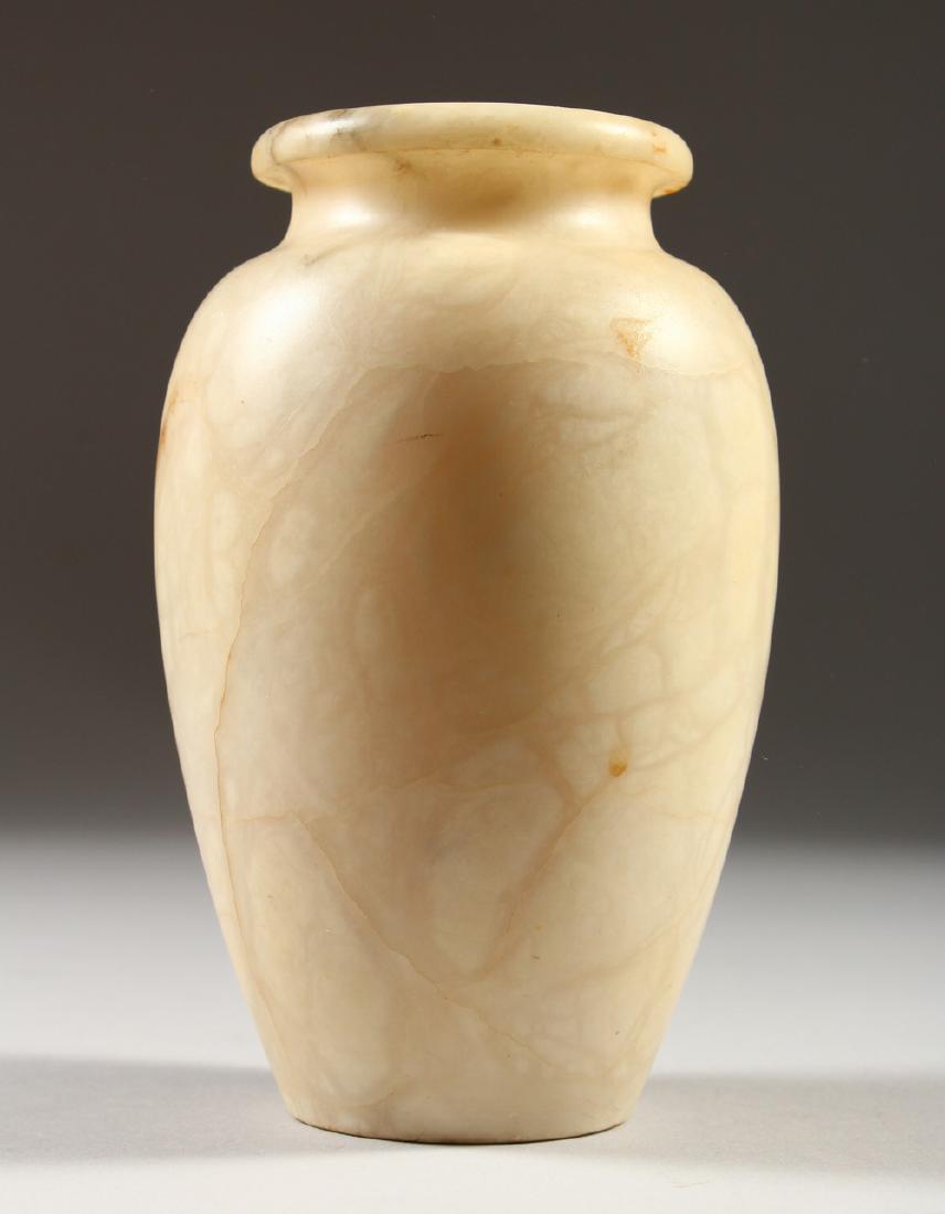 AN EGYPTIAN ALABASTER VASE. 18cms high.: AN EGYPTIAN ALABASTER VASE. 18cms high.