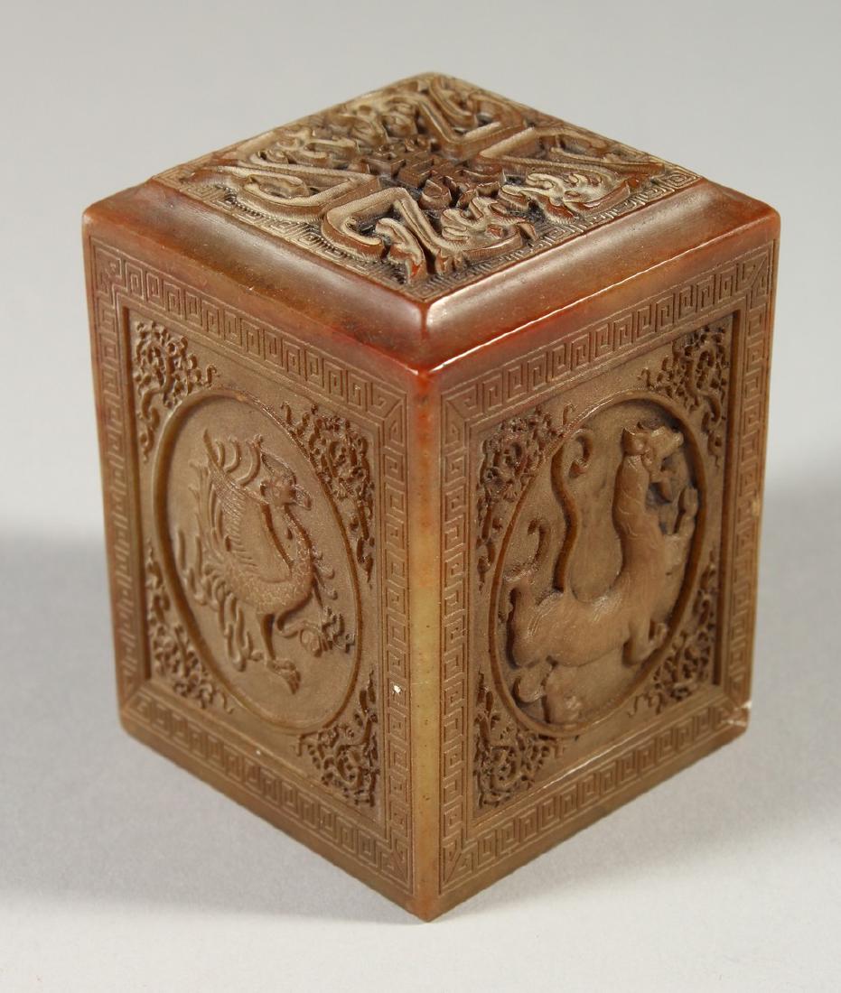 A CHINESE SQUARE CARVED SOAPSTONE SEAL. 8cms high.: A CHINESE SQUARE CARVED SOAPSTONE SEAL. 8cms high.