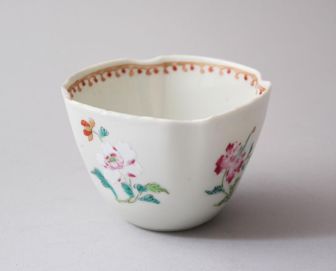 AN 18TH CENTURY CHINESE FAMILLE ROSE PORCELAIN TEA CUP,: AN 18TH CENTURY CHINESE FAMILLE ROSE PORCELAIN TEA CUP, with inverted rim corners, and finely painted enamel scenes of floral spray, 5.8cm high x 8.5 cm wide.