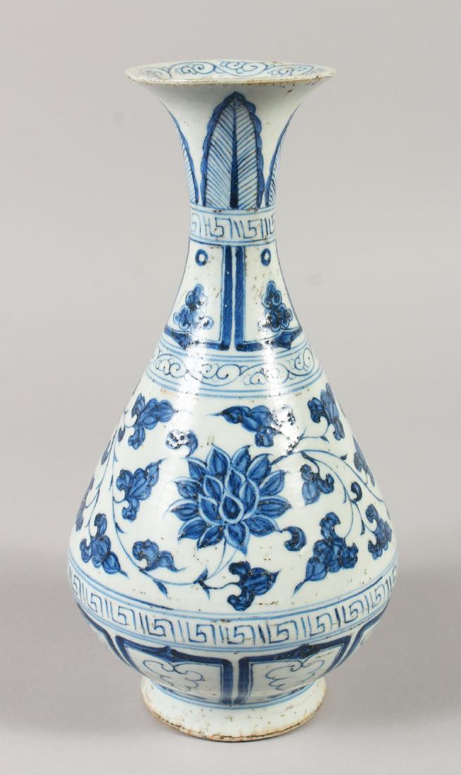 A CHINESE YUAN STYLE BLUE & WHITE YUHUCHUNPING: A CHINESE YUAN STYLE BLUE & WHITE YUHUCHUNPING PORCELAIN VASE, decorated with a wide band of scrolling lotus between formal borders, 29.8cm high.