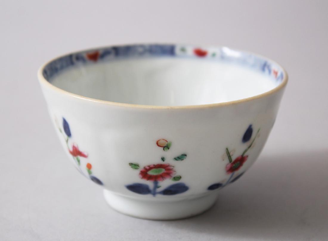 AN 18TH CENTURY CHINESE FAMILLE ROSE PORCELAIN TEA: AN 18TH CENTURY CHINESE FAMILLE ROSE PORCELAIN TEA BOWL, decorated with floral scenes and figures exterior, 9cm diameter x 5cm high.