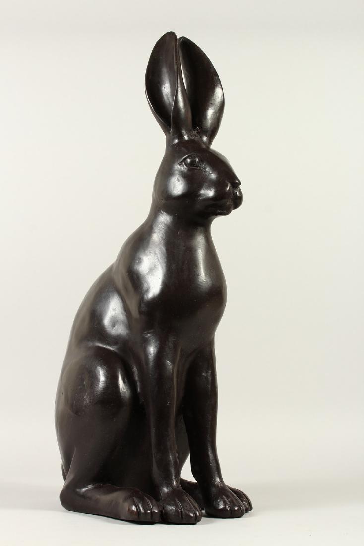 A LARGE BRONZE MODEL OF A SEATED HARE. 60cms high.: A LARGE BRONZE MODEL OF A SEATED HARE. 60cms high.