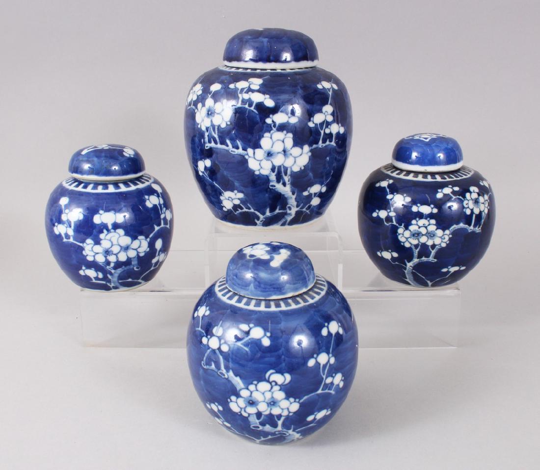 FOUR VARIOUS 19TH CENTURY AND EARLY 20TH CENTURY BLUE: FOUR VARIOUS 19TH CENTURY AND EARLY 20TH CENTURY BLUE AND WHITE GINGER JARS AND COVERS, with prunus decoration. 11cms (3) and 16cms (1).