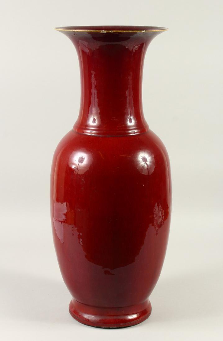 A LARGE 19TH CENTURY CHINESE SANG DE BOEUF PORCELAIN: A LARGE 19TH CENTURY CHINESE SANG DE BOEUF PORCELAIN VASE, 61cm high x 25 cm wide.