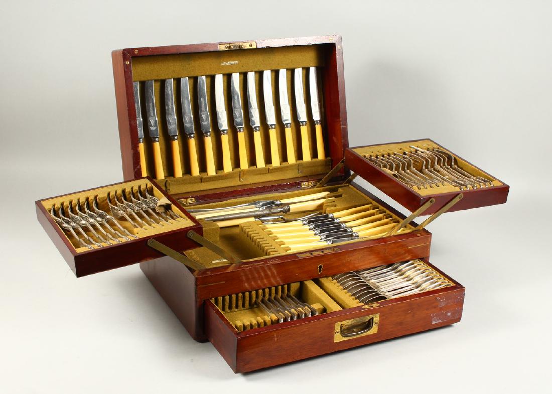 A PART CANTEEN OF SHEFFIELD FIDDLE, SHELL AND THREAD: A PART CANTEEN OF SHEFFIELD FIDDLE, SHELL AND THREAD CUTLERY, Sheffield 1931, Maker: E.V., comprising twelve table forks, twelve dessert forks, twelve dessert spoons and six tablespoons, twelve table 