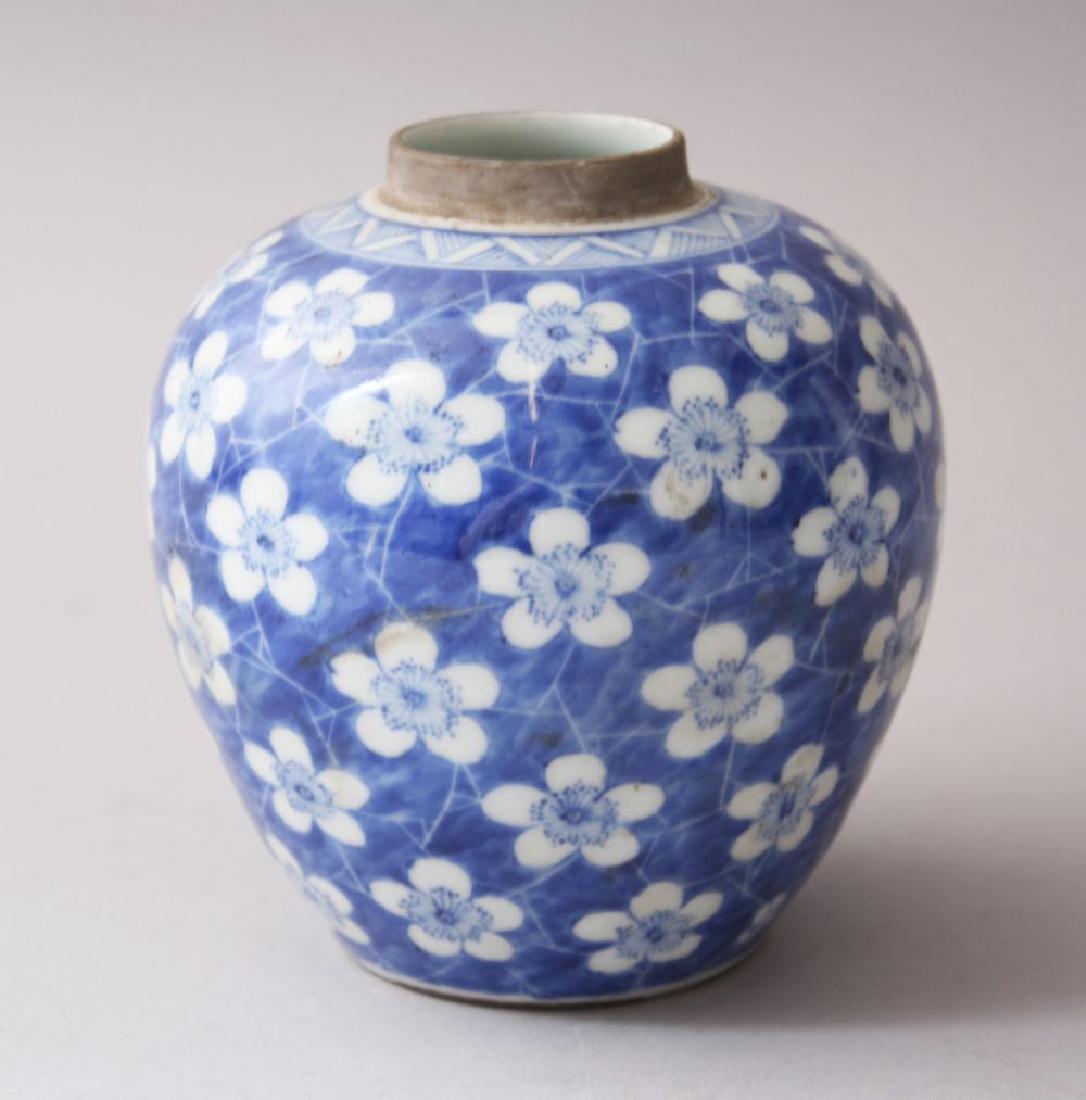 A 19TH CENTURY CHINESE BLUE & WHITE PORCELAIN PRUNUS: A 19TH CENTURY CHINESE BLUE & WHITE PORCELAIN PRUNUS GINGER JAR, 12cm high x 12cm wide.