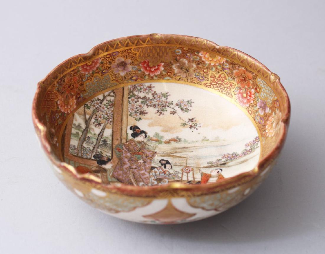 A JAPANESE MEIJI PERIOD SATSUMA PORCELAIN BOWL, painted: A JAPANESE MEIJI PERIOD SATSUMA PORCELAIN BOWL, painted with scenes of ladies and children in a landscape setting, the edges with painted floral borders, the base with a four character mark, 12cm diam