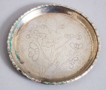 A CHINESE SOLID SILVER DISH BY YUAN SHUN, with carved: A CHINESE SOLID SILVER DISH BY YUAN SHUN, with carved decoration of cherry blossom, 8.5cm diameter, 38.7gms.