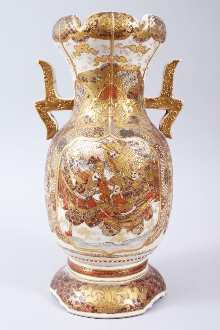 A JAPANESE LATE MEIJI / TAISHO PERIOD TWIN HANDLE: A JAPANESE LATE MEIJI / TAISHO PERIOD TWIN HANDLE SATSUMA VASE, the body with gilded decoration of immortals interior, the remaining body with flora, birds, clouds, 33cm high x 18cm wide.