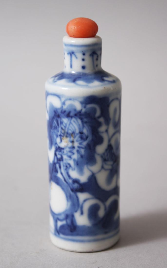 A 19TH CENTURY CHINESE BLUE & WHITE PORCELAIN SNUFF: A 19TH CENTURY CHINESE BLUE & WHITE PORCELAIN SNUFF BOTTLE, the body decorated with scenes of an intertwines dragon amongst waves & foliage, 8cm high x 2.5cm diameter,