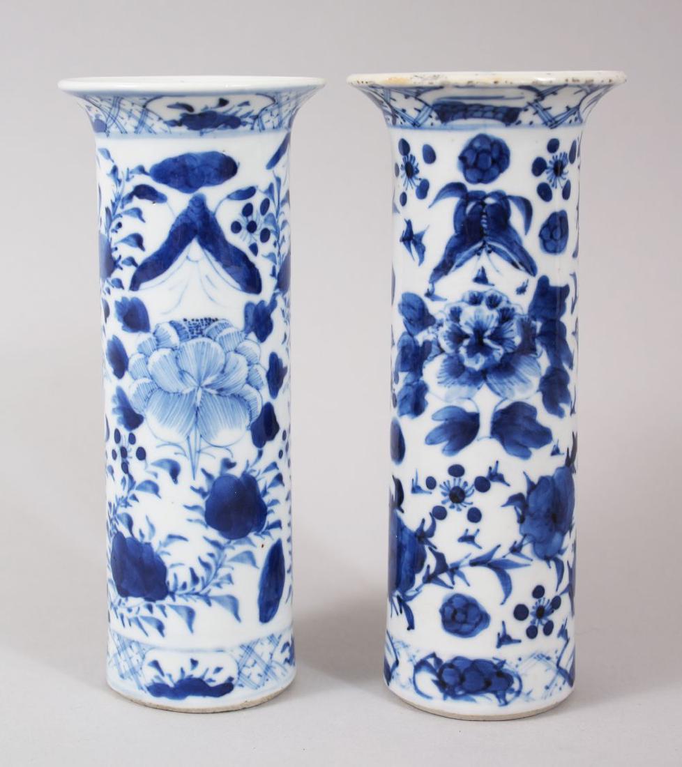 A PAIR OF 19TH CENTURY CHINESE BLUE & WHITE PORCELAIN: A PAIR OF 19TH CENTURY CHINESE BLUE & WHITE PORCELAIN SPILL VASES, the body's with floral decoration, the bases with four character Kangxi marks, 15.5cm high.