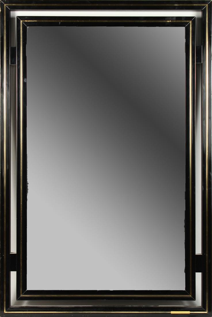 PIERRE VANDEL,PARIS, A POLISH BLACK METAL FRAMED WALL: PIERRE VANDEL,PARIS, A POLISH BLACK METAL FRAMED WALL MIRROR with gilt metal decoration. 89cms high x 60cms wide.