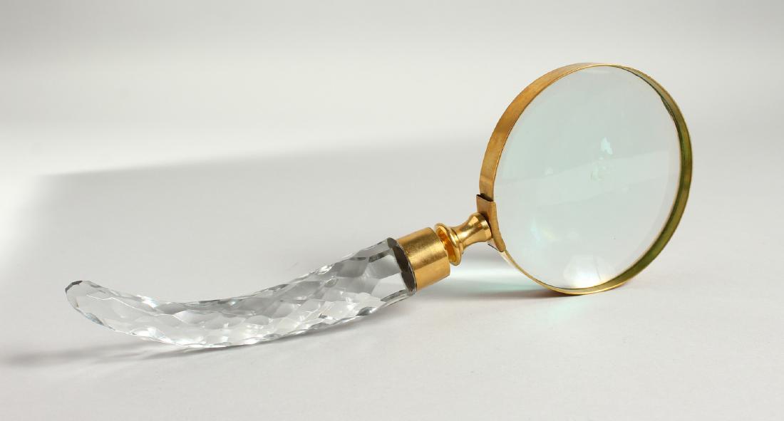 A MAGNIFYING GLASS with cut glass handle.: A MAGNIFYING GLASS with cut glass handle.