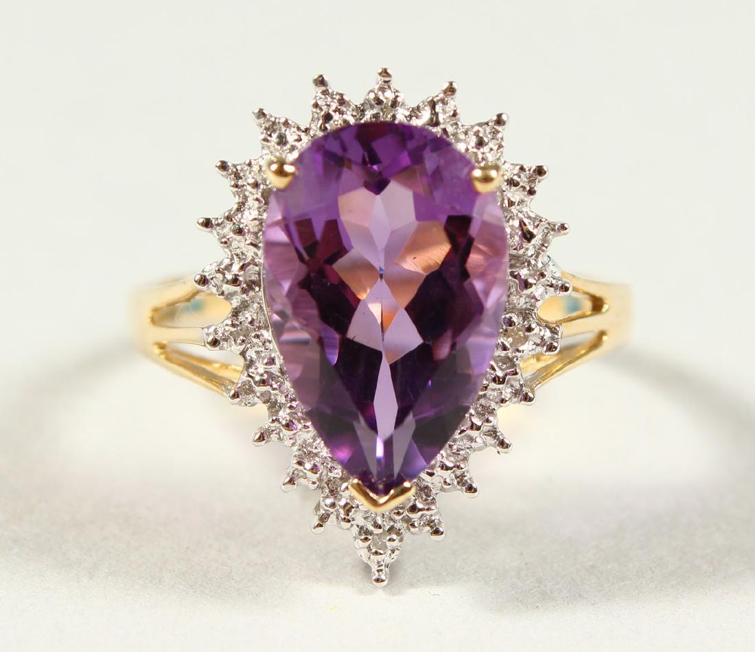 A GOOD 9CT GOLD TEAR DROP AMETHYST AND DIAMOND RING,: A GOOD 9CT GOLD TEAR DROP AMETHYST AND DIAMOND RING, boxed.