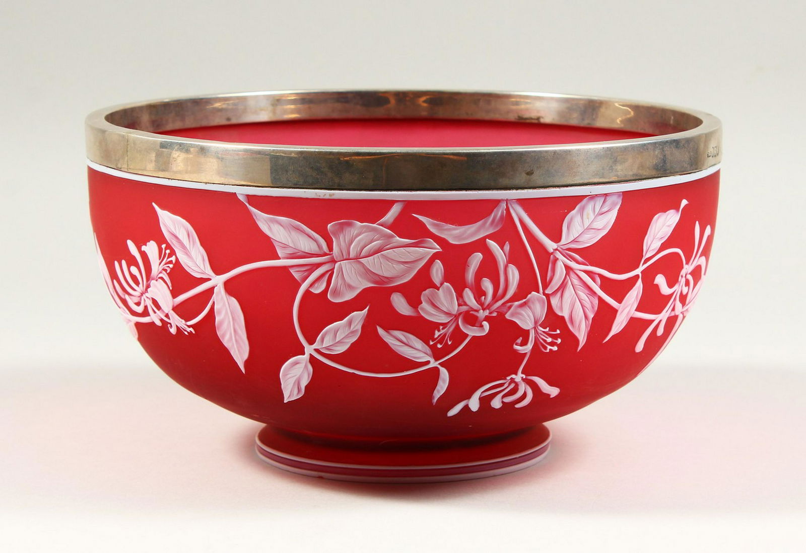 A SUPERB THOMAS WEBB RED AND WHITE CAMEO GLASS CIRCULAR: A SUPERB THOMAS WEBB RED AND WHITE CAMEO GLASS CIRCULAR SALAD BOWL, with silver band. Signed. 9ins diameter.