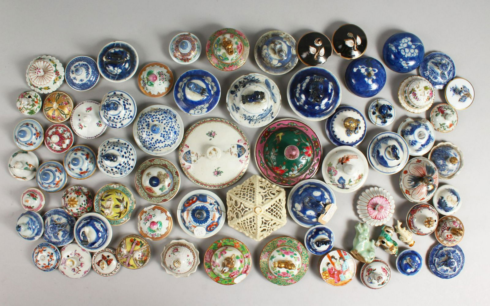 A BOX OF SMALL POT LIDS. (1 of 15)